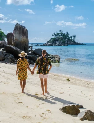 Couple on Vacation at Anse Royale Beach in Mahe Seychelles.