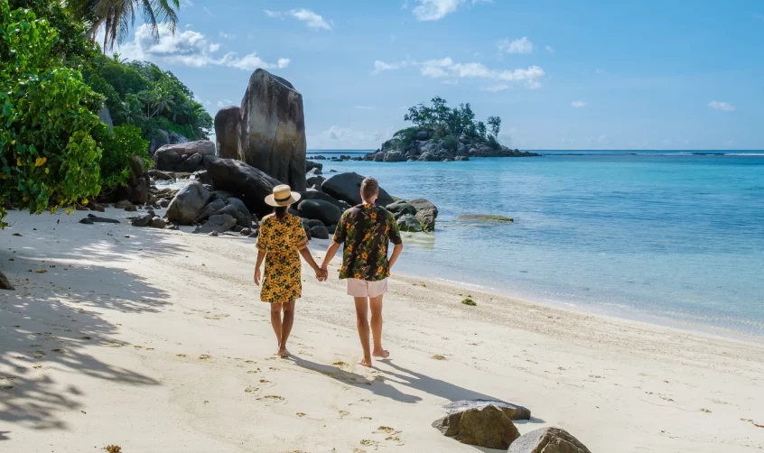 Couple on Vacation at Anse Royale Beach in Mahe Seychelles.