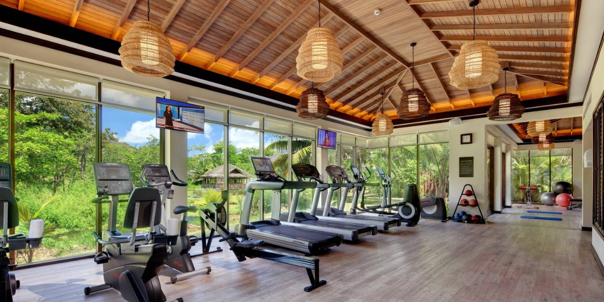 Story Seychelles gym with modern equipment and amazing views of the lush island nature.