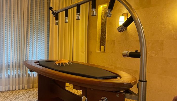 Vichy shower treatment room in a luxury Seychelles wellness resort.