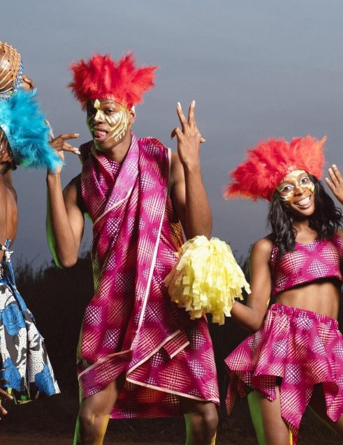 A Group of people dressed for a carnival