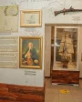 Seychelles National History Museum exhibit displaying historical maps, artifacts, and a model ship related to French exploration.