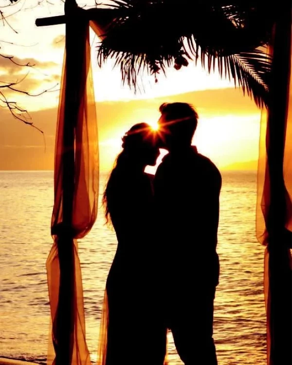 A couple kissing on a beach in Seychelles.